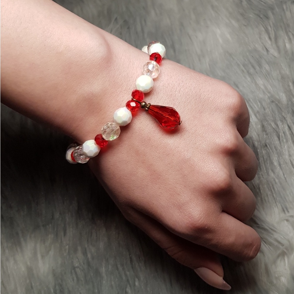 Handmade bracelet original beaded design with multi faceted crystal drop centre